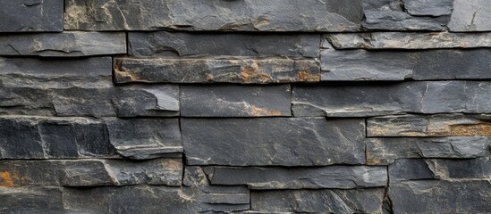 Poster - Textured slate stone wall background with layered slabs in various shades of gray and brown Copy Space