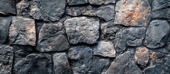Poster - Textured stone wall background with irregular shapes and dark colors ideal for architectural or artistic applications Copy Space