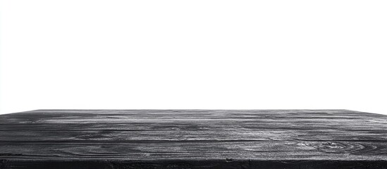 Poster - black wooden table surface with textured finish on white background and ample copy space for design 