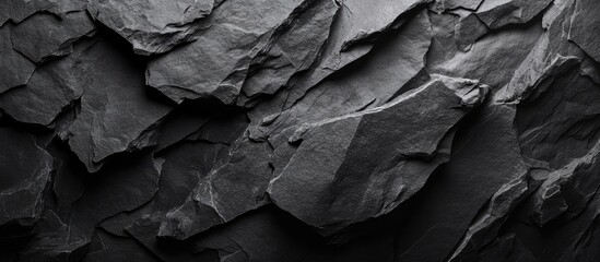 Poster - Dark textured stone surface background with layered slate rock and uneven patterns suitable for various design applications Copy Space