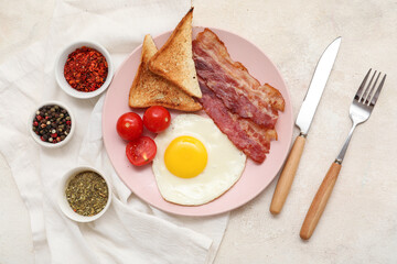 Wall Mural - Plate with fried egg, bacon, toasts, tomatoes and spices in bowls on white grunge background. Top view