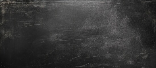Poster - Textured blank chalkboard surface with subtle scratches and uneven matte finish suitable for educational or artistic backgrounds Copy Space