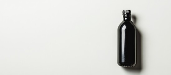 Poster - Black wine bottle on white background with shadows and ample copy space for text placement.