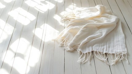 Aufkleber - White Soft Linen Blanket Draped on Light Wooden Floor with Natural Sunlight Shadows