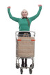 © ASDF - in full growth. smiling woman with a shopping cart