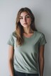 © Maftuh - Portrait of a Young Woman in a Sage Green T-Shirt
