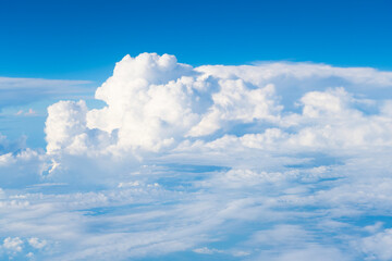 Wall Mural - blue sky with a clouds. Clear blue sky panoramic background with small white clouds. Partly cloudy. White fluffy clouds in the blue sky.