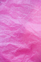 Poster - pink crumpled paper surface background.