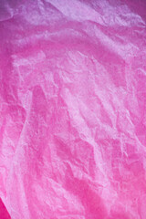 Poster - pink crumpled paper surface background.