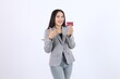 © Miftakhul Fariz - Woman Shows Credit Card and Points Happily: Finance, Payment, Shopping, and E-commerce Concepts