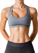 © nuruddean - Fit woman in sportswear confidently showing abs.