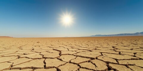 barren desert landscape with cracked dry ground under scorching sun during heatwave and drought, dry