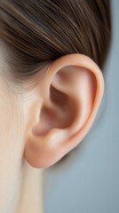 Poster - Healthy female ear is shown in close up, highlighting its delicate structure and emphasizing the importance of hearing health and audiology