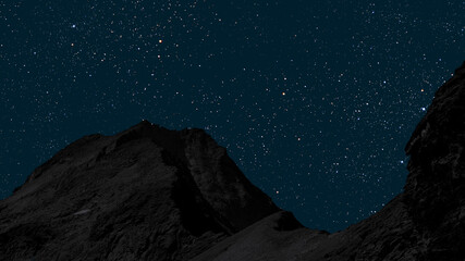 Wall Mural - a movement of stars in the night sky with the view of mountains..