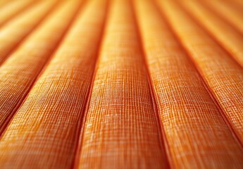 Poster - Close-Up of Textured Orange Fabric Showing Pleats and Fine Weave in a Warm Tone Creating a Vibrant and Inviting Visual for Background or Upholstery Use