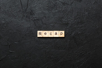 Wall Mural - recap word written on wood block. recap text on table, concept