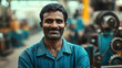 © Катерина Спіжевска - A smiling, handsome young Indian male factory worker wearing a blue uniform