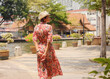 © YURII Seleznov - Young woman in ethnic dress and hat exploring the vibrant streets of Malacca, Malaysia. A blend of cultural heritage, colorful architecture, and tropical charm. Perfect travel and lifestyle moments.