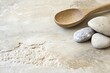 © masud - Natural Stone Surface with Wooden Spoon and Rocks