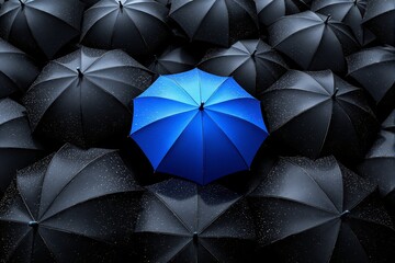 Aufkleber - Blue umbrella standing out among black umbrellas with raindrops.