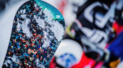 Poster - A close-up shot of a snowboard lying in fresh snow