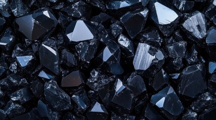 Wall Mural - close-up of shiny black mineral stones with natural light reflections.