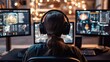 © redflower - A rear view of a pilot wearing headphones, focused on multiple computer screens displaying an aerial combat simulation.