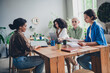 © deagreez - Portrait of team ambitious business women laptop documents desk modern interior office indoors