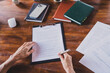 © deagreez - First person view portrait of woman hold pen sign document clipboard desk business center office indoors