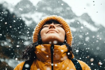 Poster - A person standing in the rain without an umbrella, looking up at the sky with water streaming down their face