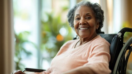 Wall Mural - A woman in a wheelchair is smiling and holding a cell phone. Concept of happiness and contentment, as the woman is enjoying her time in the wheelchair