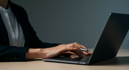 Canvas Print - Woman is typing on a laptop