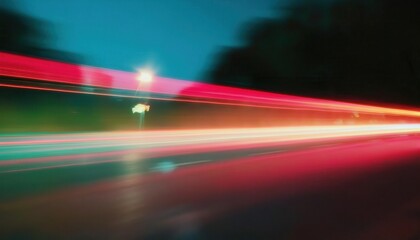 Poster - dynamic urban motion blur with vibrant red and teal light trails captured on a dark city street for futuristic and modern designs

