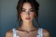 © Michael - Portrait of a beautiful young bride wearing a white dress and elegant necklace, showing her makeup and elegant hairstyle