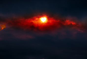 Wall Mural - Valentines day background with hearts shaped sun and red abstract clouds.