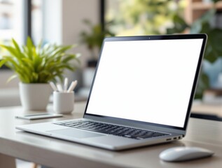 Aufkleber - a laptop with a blank white screen, a mouse, a book, and a plant on a desk in a well-lit room with large windows. mockup 