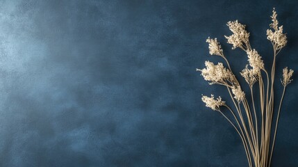 Poster - Dried decorative grass on blue textured background with copy space for text or design elements