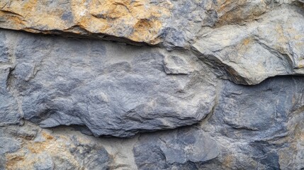 Poster - Textured gray and yellow natural rock surface with rough edges and varied color tones, suitable for backgrounds with Copy Space.