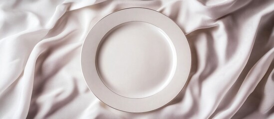Poster - White empty plate on elegant satin fabric background with copy space for text or design