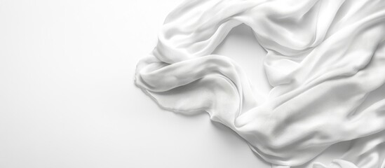 Fototapete - White silk fabric draped on a white background with ample Copy Space for text placement