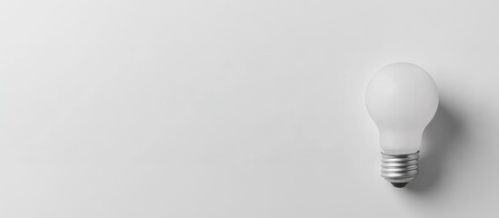 Poster - Light bulb on white background with copy space for text or advertising