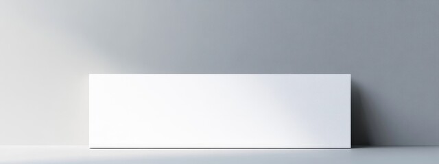 Fototapete - Minimalist white panel on gray wall with soft light and Copy Space for text placement