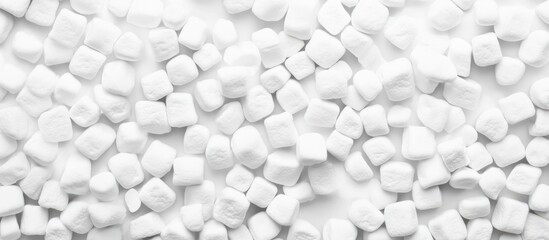 Poster - White sugar cubes scattered on a white background with ample Copy Space for text insertion