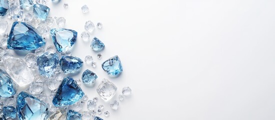 Poster - Blue and clear gemstones with water droplets on a white background featuring ample copy space for text