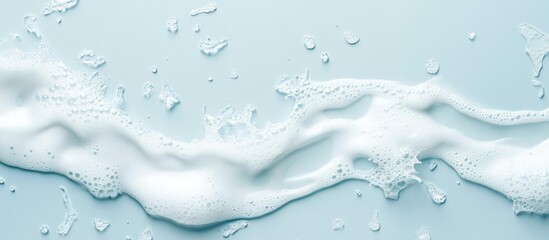 Poster - foamy water waves on a blue background with copy space for text placement