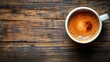 © NeuralNiche - Coffee cup on rustic wooden table with rich crema texture and copy space for text
