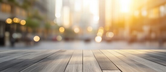 Poster - wooden table top against a blurred urban street view with sunlight and bokeh effect copy space