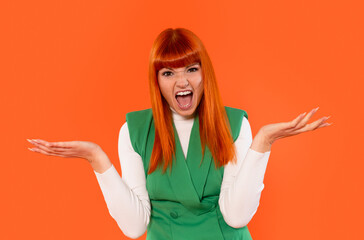 Brightly dressed woman expresses excitement against a vivid orange background