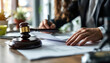 © doro - Legal Professionals Reviewing Documents with Gavel