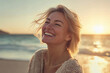 © MashMash - Serene middle-aged woman enjoying a peaceful moment on a sunny beach with ocean waves in the background, showcasing natural beauty, relaxation, and carefree emotions for lifestyle, travel, and wellnes